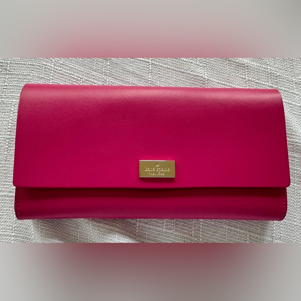 Kate Spade bright pink wallet with light pink interior
